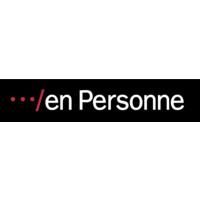 En personne